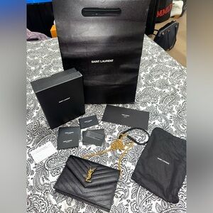 YSL Monogram Envelope Chain Wallet in black grained leather